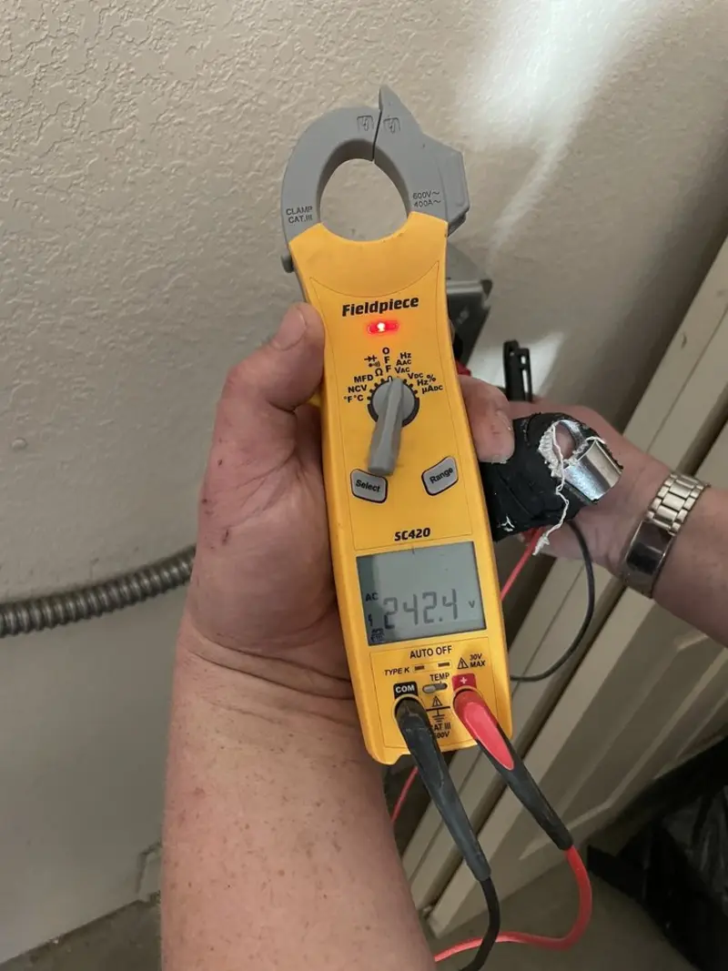 Voltage testing with clamp meter during Circuit Breaker Repair in Artesia